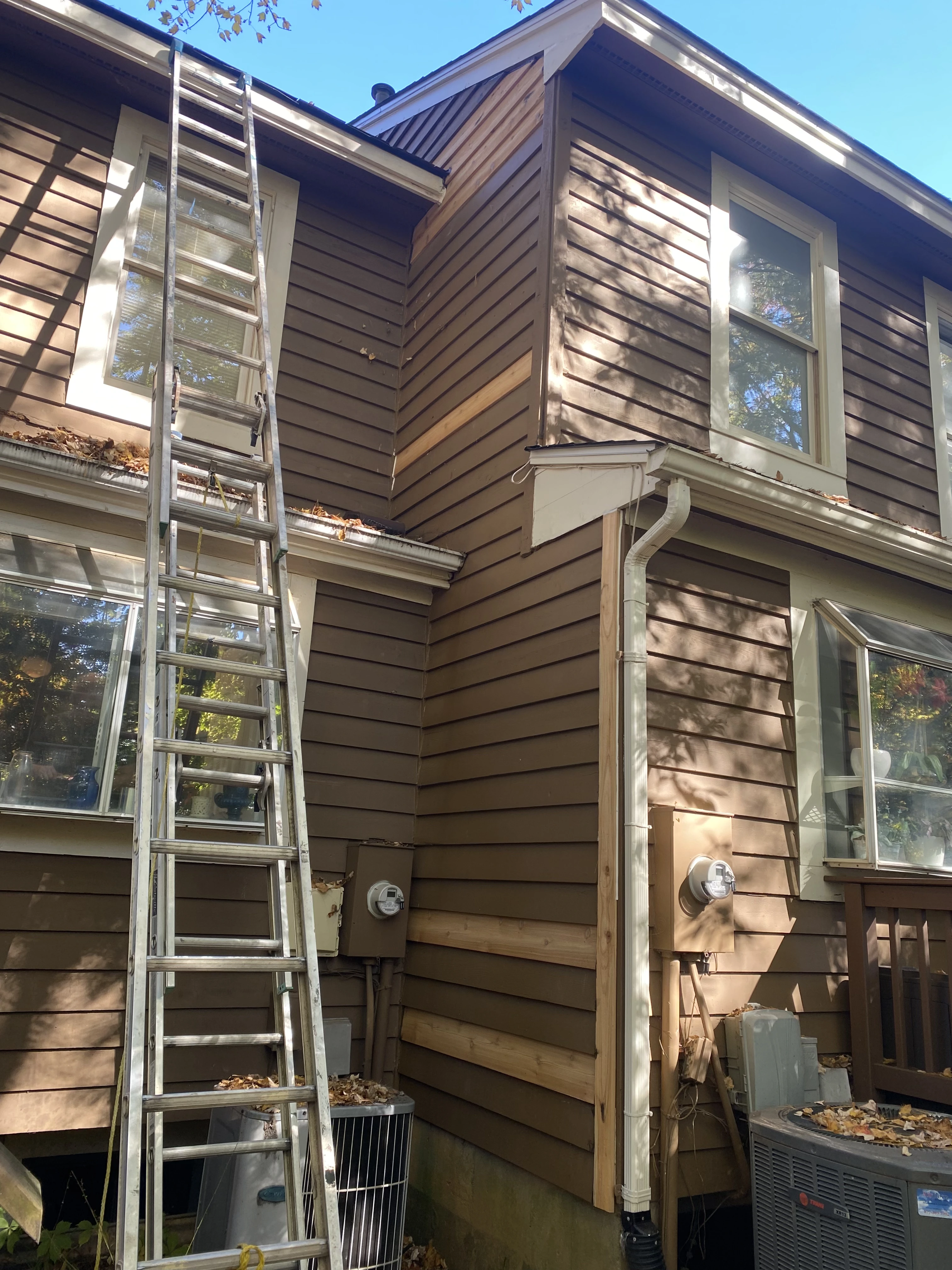 Installing new cedar siding to match existing