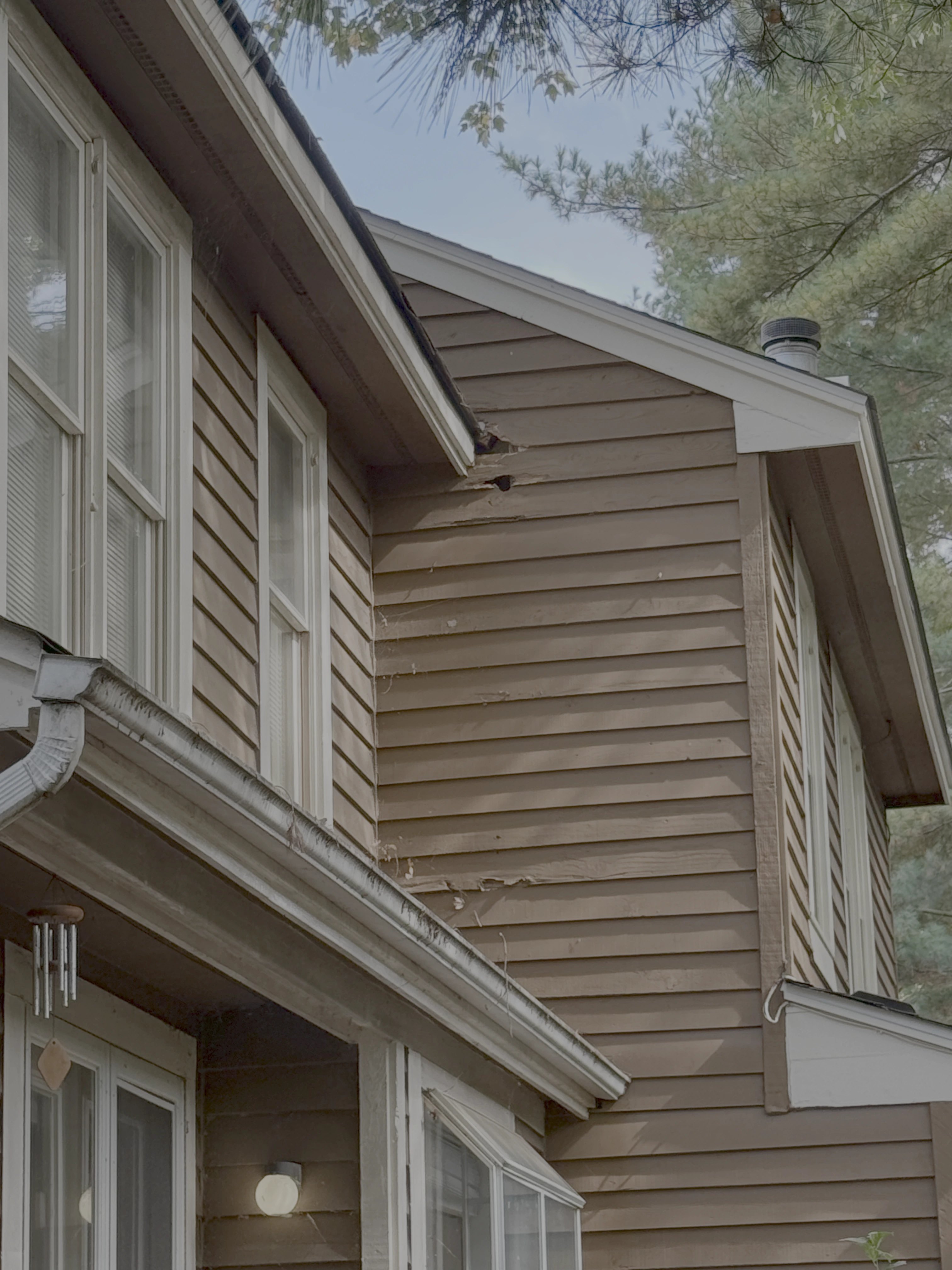 Rotted cedar siding before repair in Reston VA
