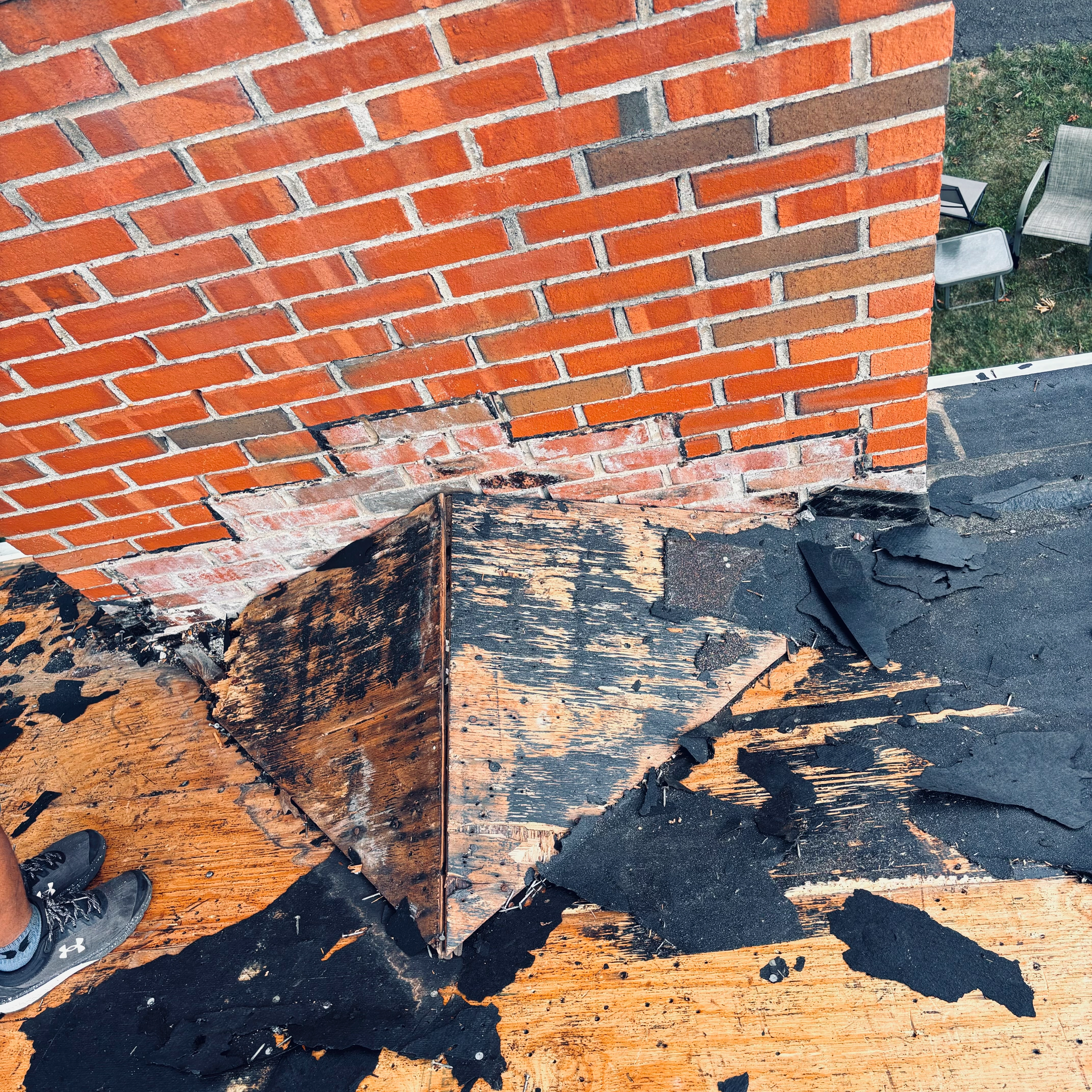 Tree damaged roof before emergency repair